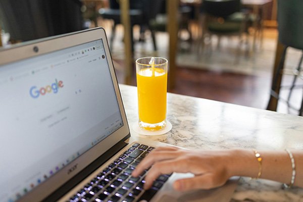 Person using a computer in a public setting.